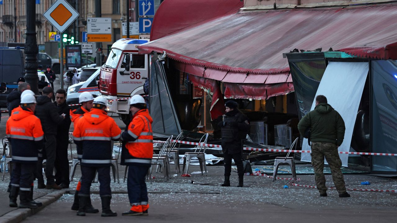Investigators and members of emergency services work at the site of an explosion at a cafe in St. Petersburg, Russia on April 2, 2023.