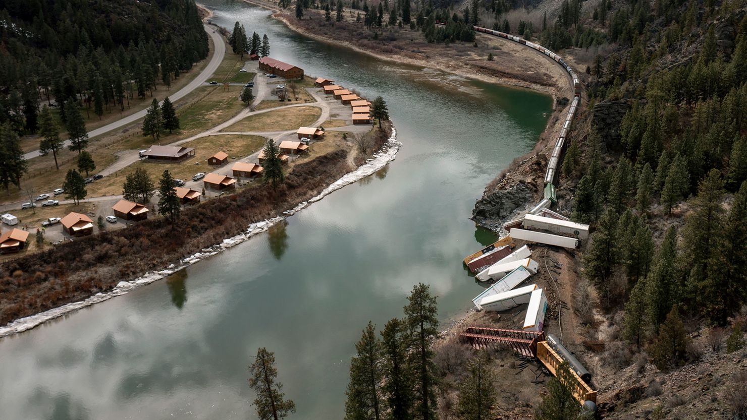 A train sits derailed near Quinn's Hot Springs Resort west of St. Regis, Montana, on Sunday.