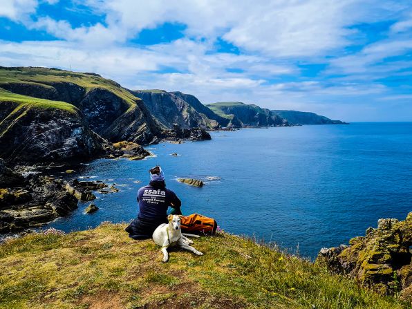 <strong>Epic walk: </strong>In August 2017, former paratrooper Christian<strong> </strong>Lewis, seen in St. Abbs, Scotland, set off from Swansea, Wales, with the aim of walking the entire UK coastline. He picked up dog Jet in Northern Ireland around nine-months into the journey.