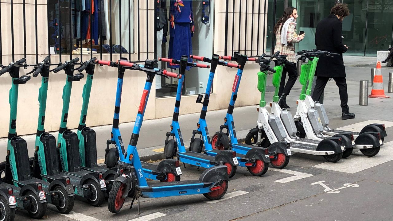 E-scooters from three different suppliers are parked in a designated parking space on March 31, 2023 in Paris. 