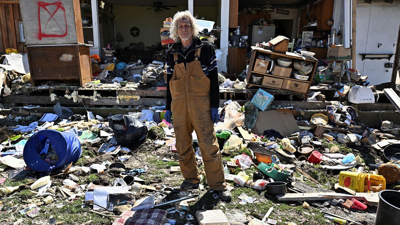 Calvin Cox stands in front of his destroyed home, two days after a tornado hit Sullivan, Indiana on Friday.