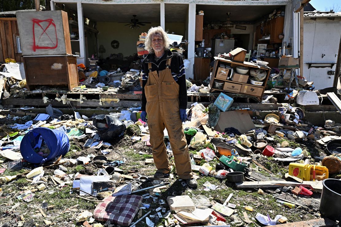 Calvin Cox stands in front of his destroyed home Sunday after a tornado struck Sullivan, Indiana.