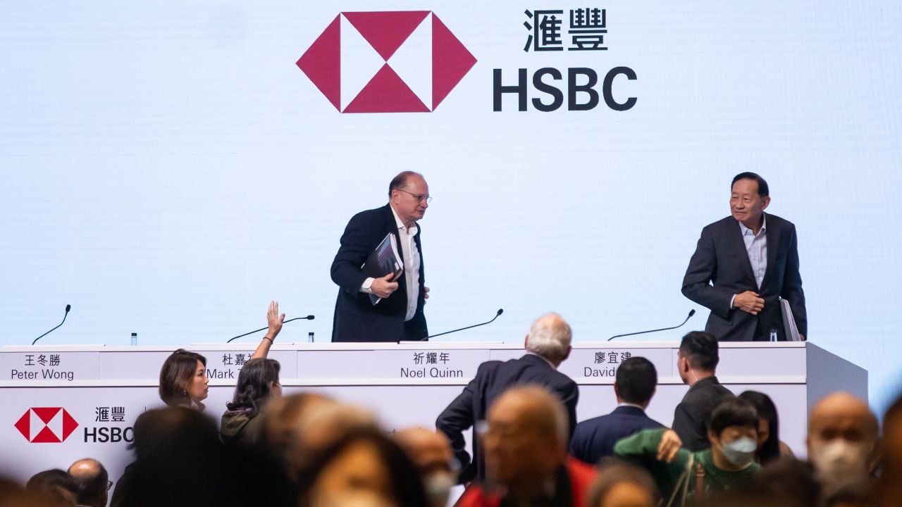 Mark Tucker, chairman of HSBC, left, and Peter Wong, chairman of the Hong Kong and Shanghai Banking Corporation, departing following the bank's shareholders meeting in Hong Kong on Monday.