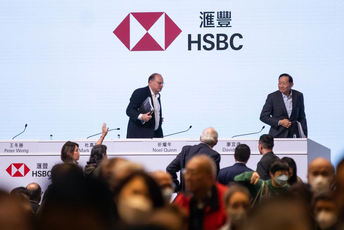 Mark Tucker, chairman of HSBC, left, and Peter Wong, chairman of the Hong Kong and Shanghai Banking Corporation, departing following the bank's shareholders meeting in Hong Kong on Monday.