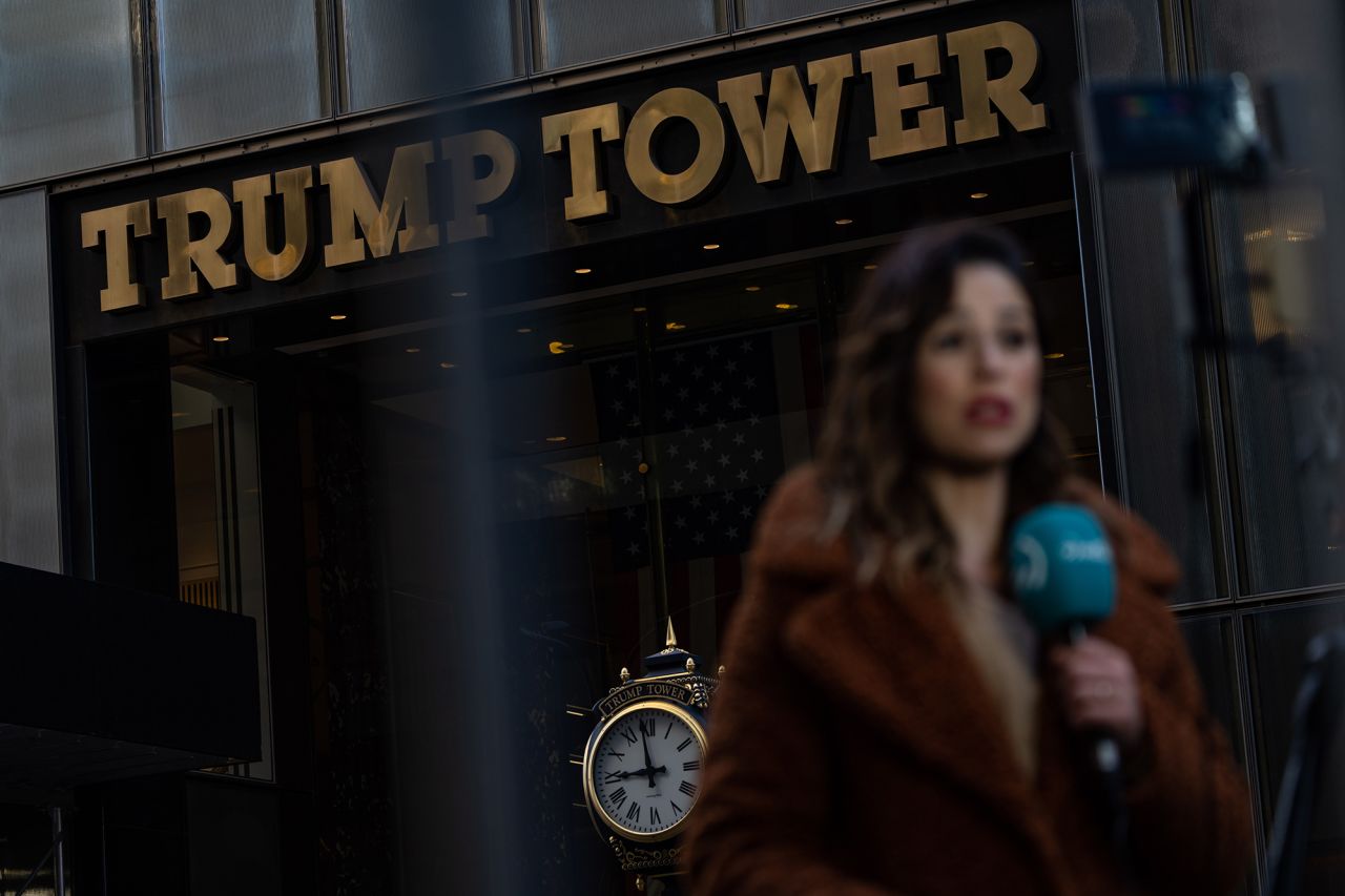 A television news reporter is seen outside Trump Tower in New York on Monday, April 3. Former US President Donald Trump was staying there ahead of his arraignment on Tuesday. 