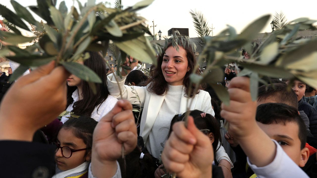 Christians gather to celebrate Palm Sunday at the St. Elijah church in Erbil, the capital of the autonomous Kurdish region of northern Iraq, on Sunday. 
