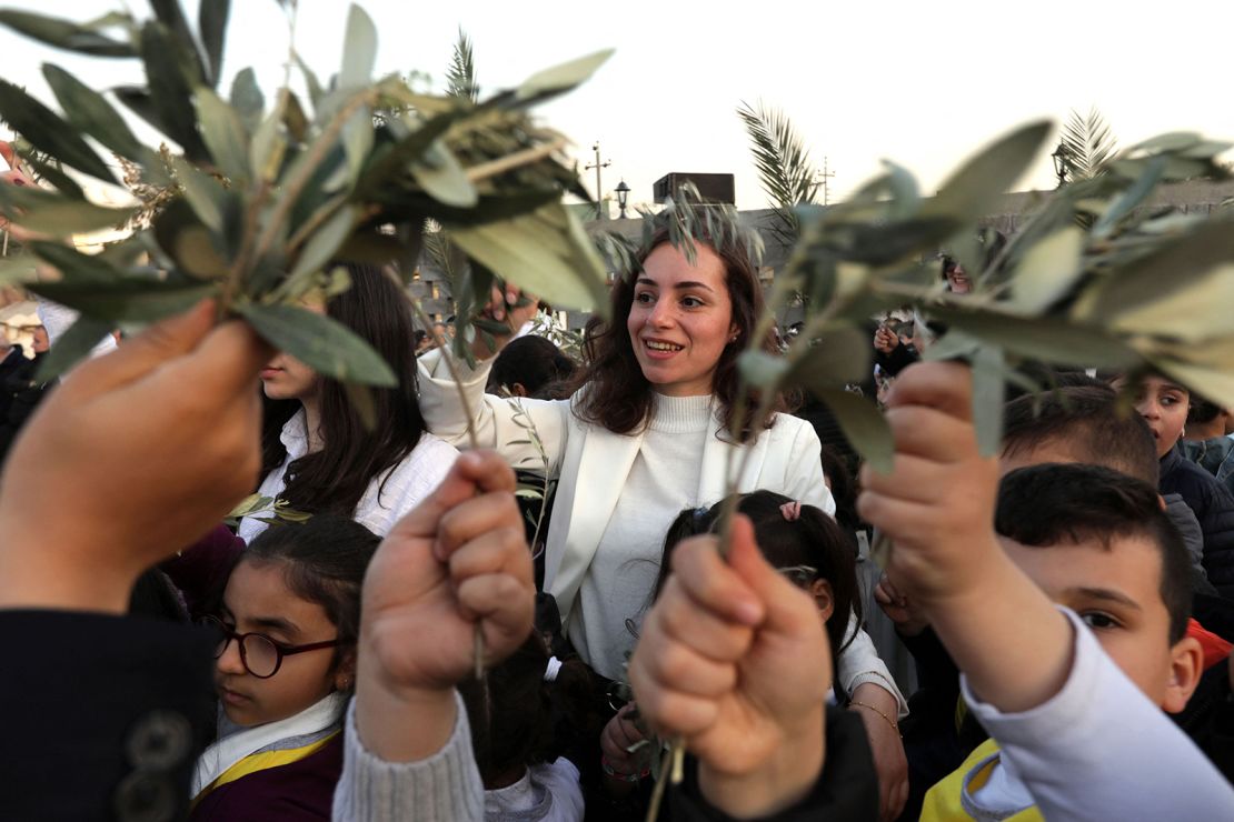 Christians gather to celebrate Palm Sunday at the St. Elijah church in Erbil, the capital of the autonomous Kurdish region of northern Iraq, on Sunday. 