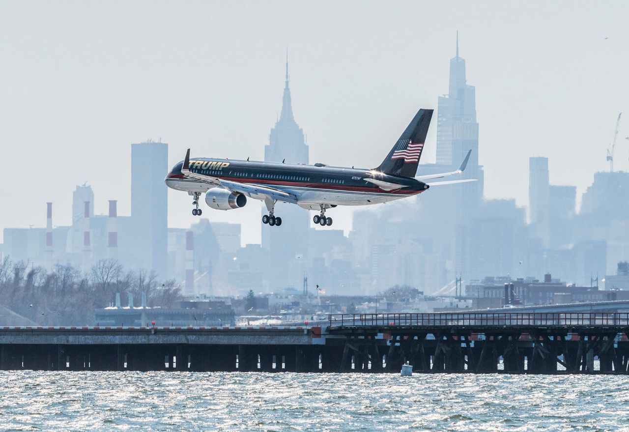 A plane carrying former US President Donald Trump lands at New York's LaGuardia Airport on Monday, April 3. It was the day before <a href=