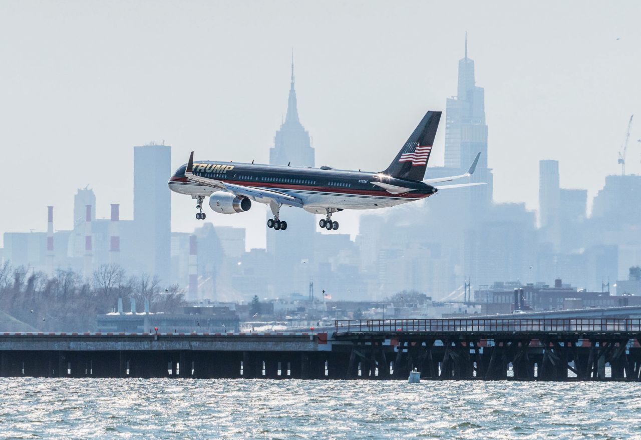 A plane carrying former US President Donald Trump lands at New York's LaGuardia Airport on Monday, April 3. It was the day before Trump's arraignment.