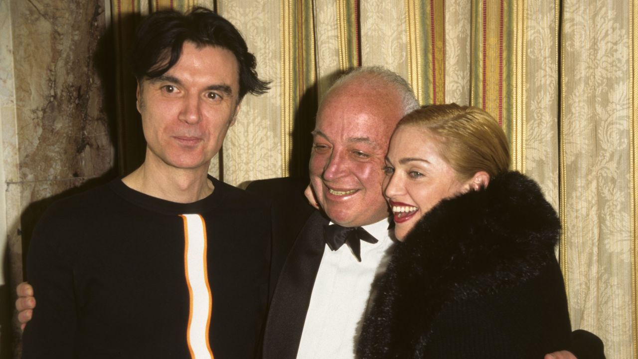 (From left) David Byrne, Seymour Stein and Madonna at the Waldorf Astoria Hotel in New York City in 1996.