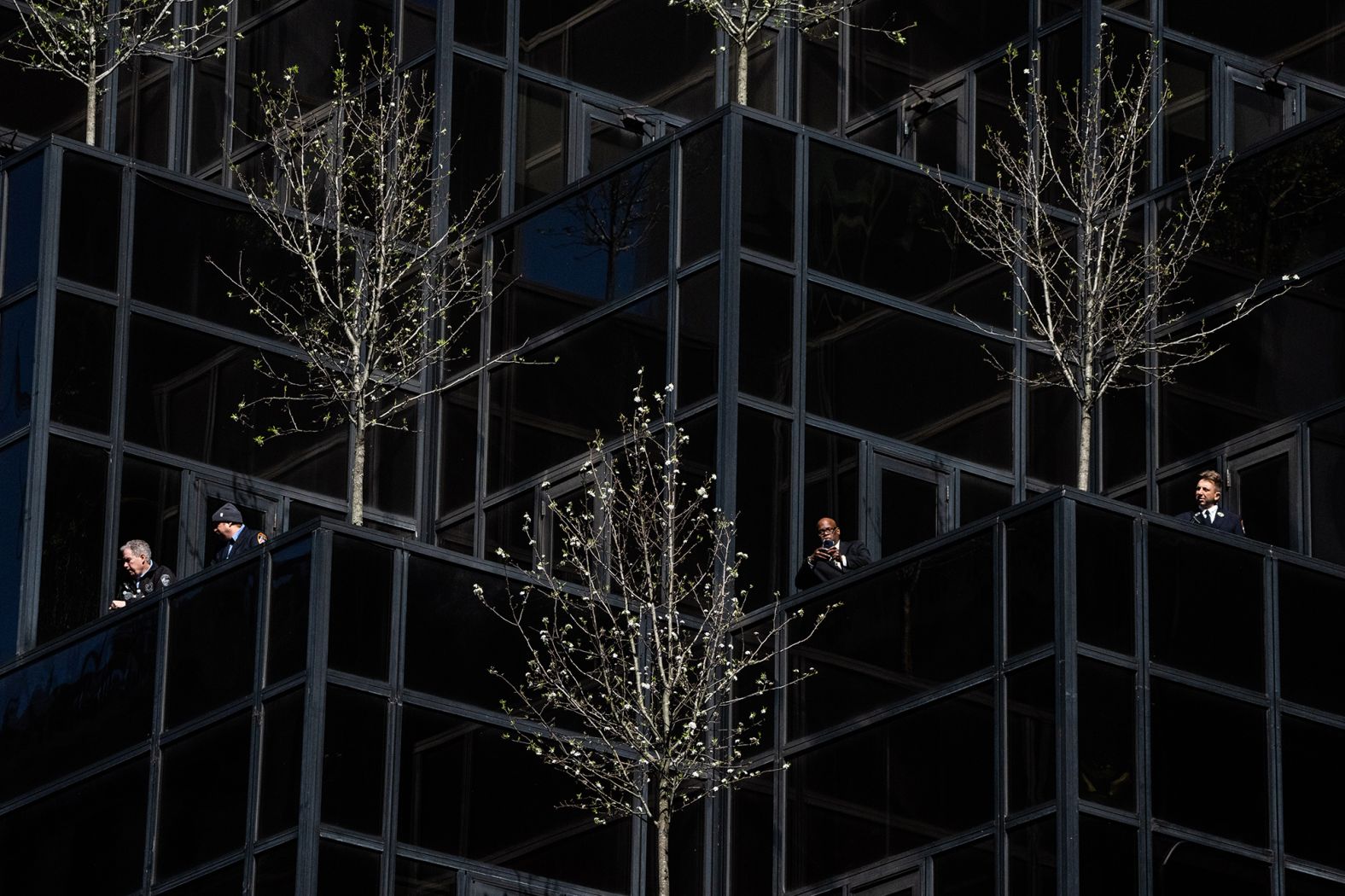 Police officers view crowds from Trump Tower on April 3.