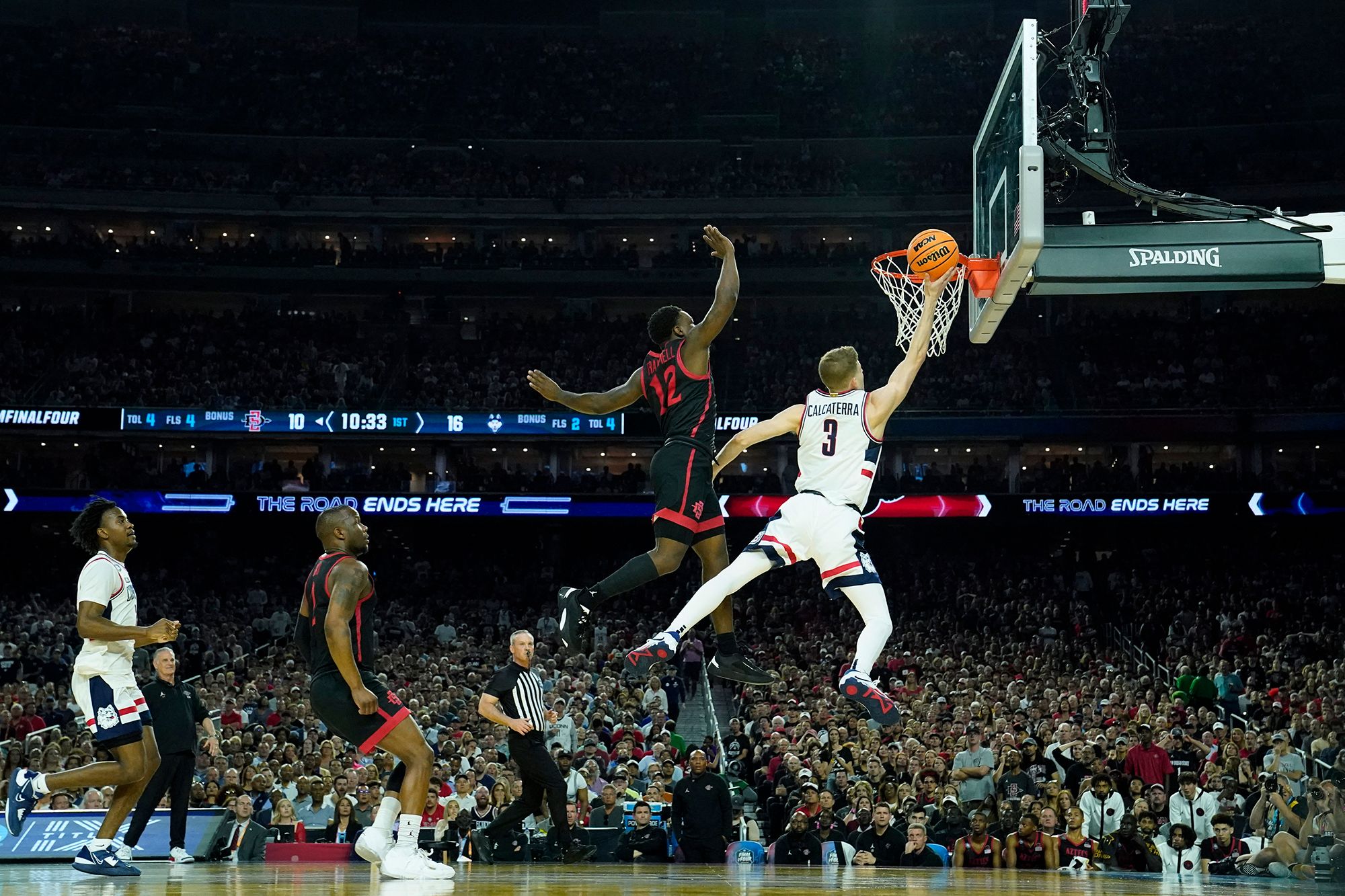 UConn's Joey Calcaterra shoots a layup during the first half.