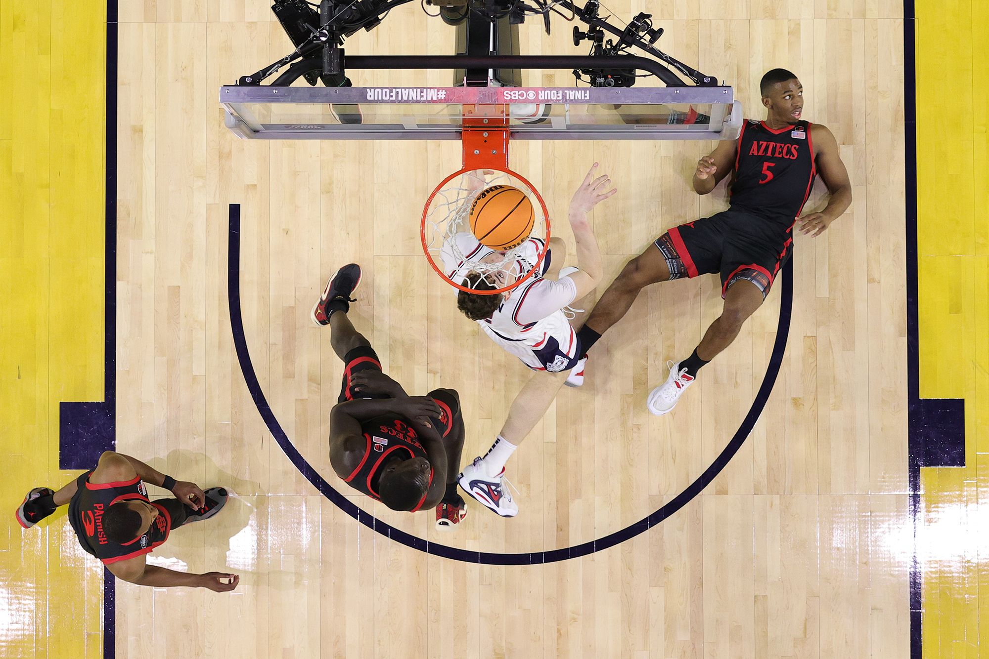 Butler, right, takes a charge on Clingan during the first half.