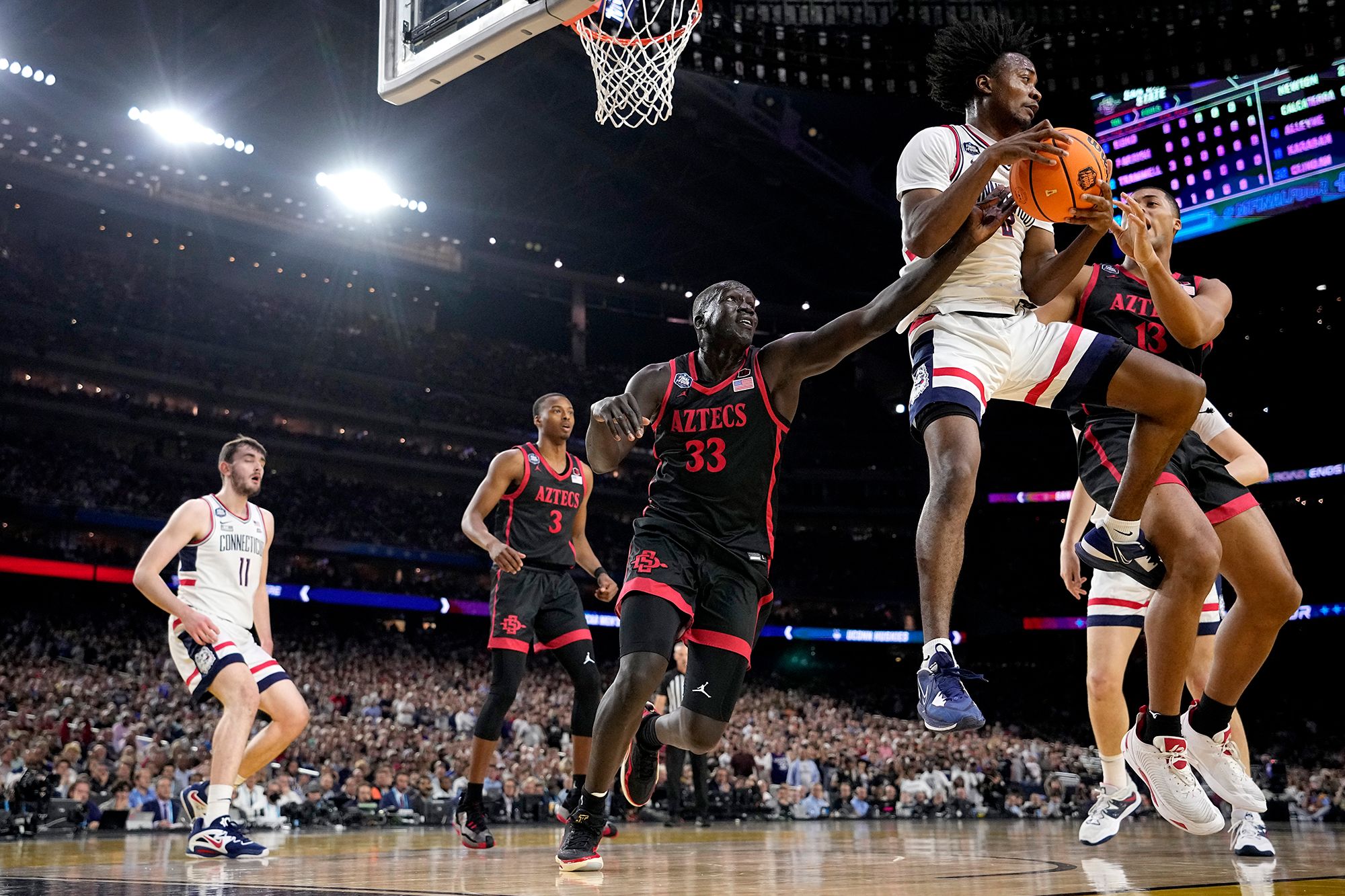 Newton pulls down a rebound in the first half.