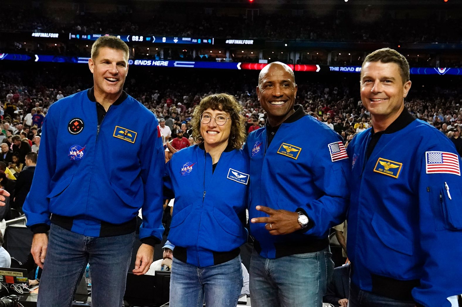 Astronauts for <a  target="_blank">the upcoming Artemis II mission</a> pose for a photo at the game. The crew members, from left, are Jeremy Hansen, Christina Hammock Koch, Victor Glover and Reid Wiseman.