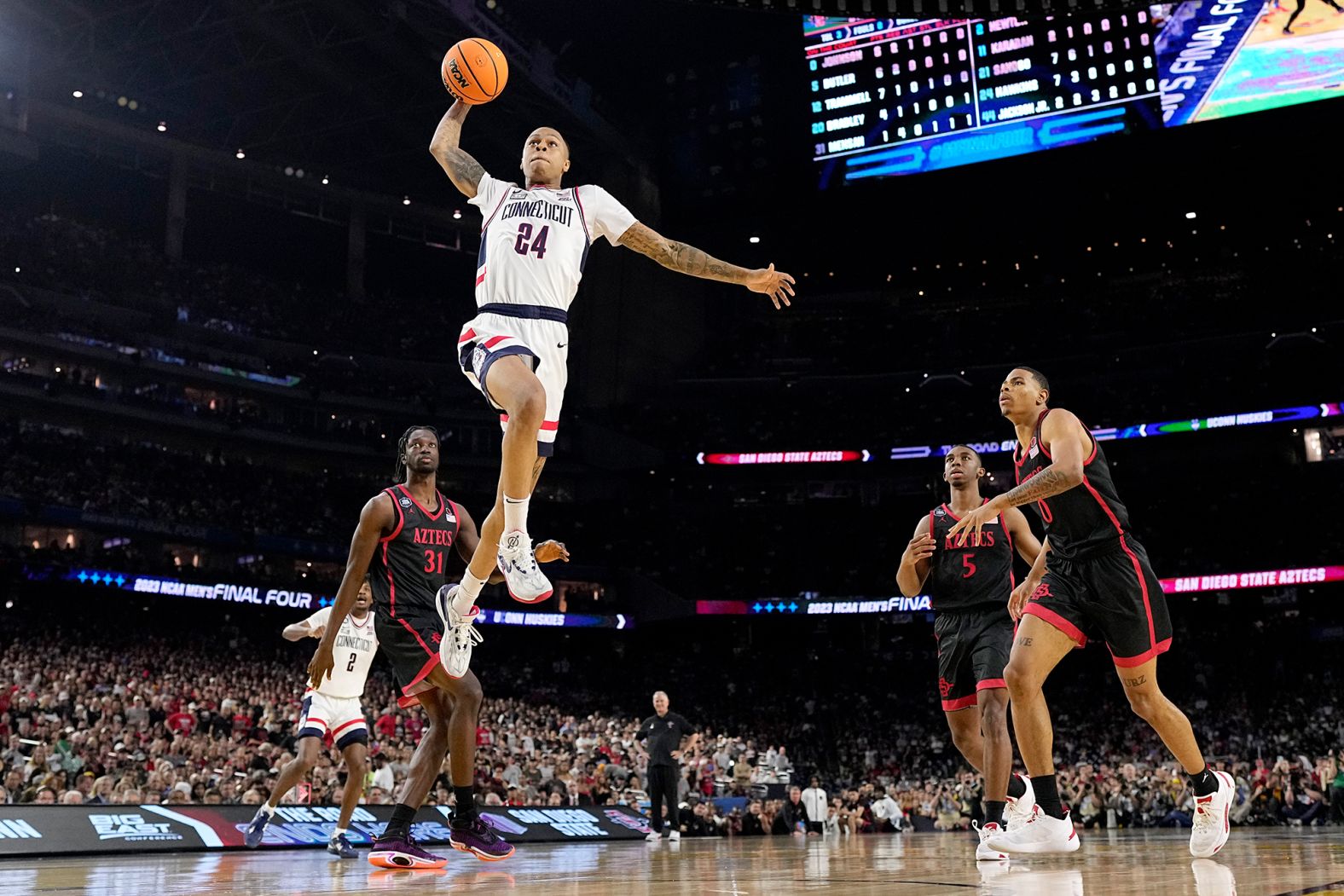 Hawkins attempts a dunk at the start of the second half. It clanged off the back of the rim.