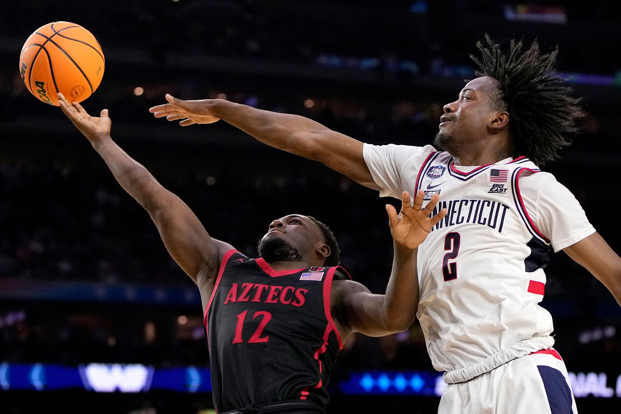 Newton blocks a shot by Darrion Trammell during the second half.