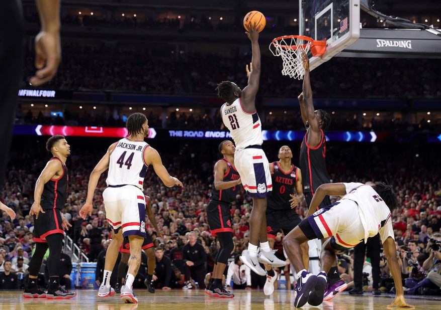 UConn's Adama Sanogo shoots the ball over Nathan Mensah. Sanogo finished with 17 points and 10 rebounds, and he was later named the tournament's most outstanding player.