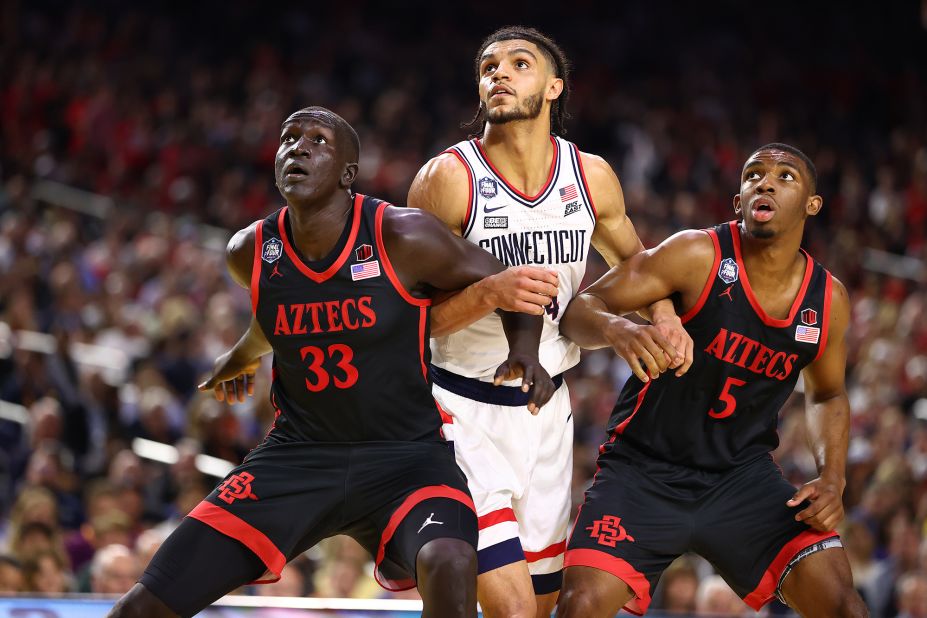 From left, San Diego State's Aguek Arop, UConn's Andre Jackson Jr. and Butler box out during a second-half free throw.