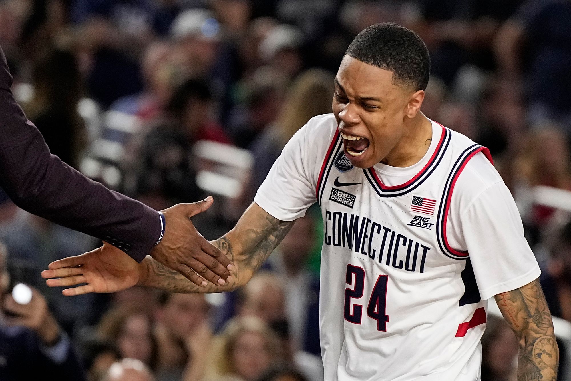 UConn guard Jordan Hawkins celebrates during the second half.