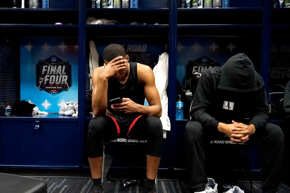 San Diego State's Micah Parrish and Tyler Broughton sit in the locker room after the game.