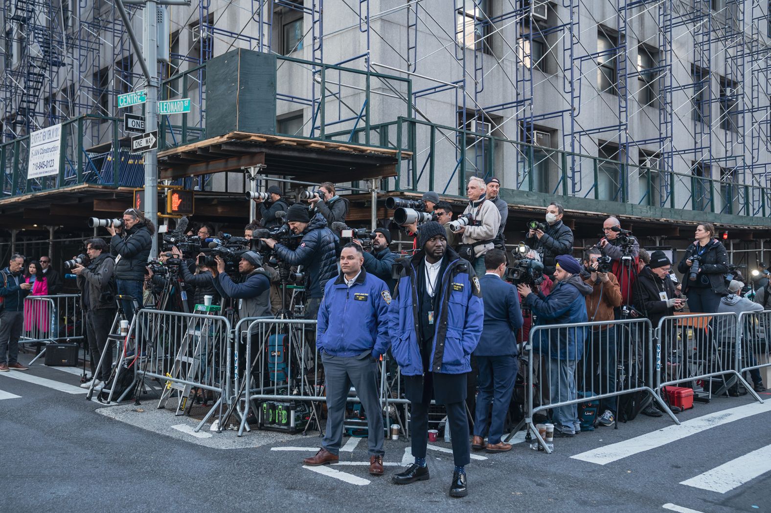 Members of the media gather outside the courthouse on April 4.