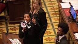 Tennessee State Representative Justin Jones, standing with Rep. Justin Pearson and Rep. Gloria Johnson, calls on his colleagues to pass gun control legislation from the well of the House Chambers during the legislative session, three days after the mass shooting at The Covenant School, at the State Capitol in Nashville, Tennessee on March 30, 2023.