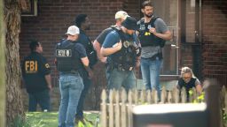 Metro Nashville Police and FBI search and investigate a house in the 3000 block of Brightwood Ave. following a mass shooting at Covenant School, Monday, March 27, 2023, in Nashville, Tenn. The shooter was killed by police on the scene. (Andrew Nelles/The Tennessean via AP)
