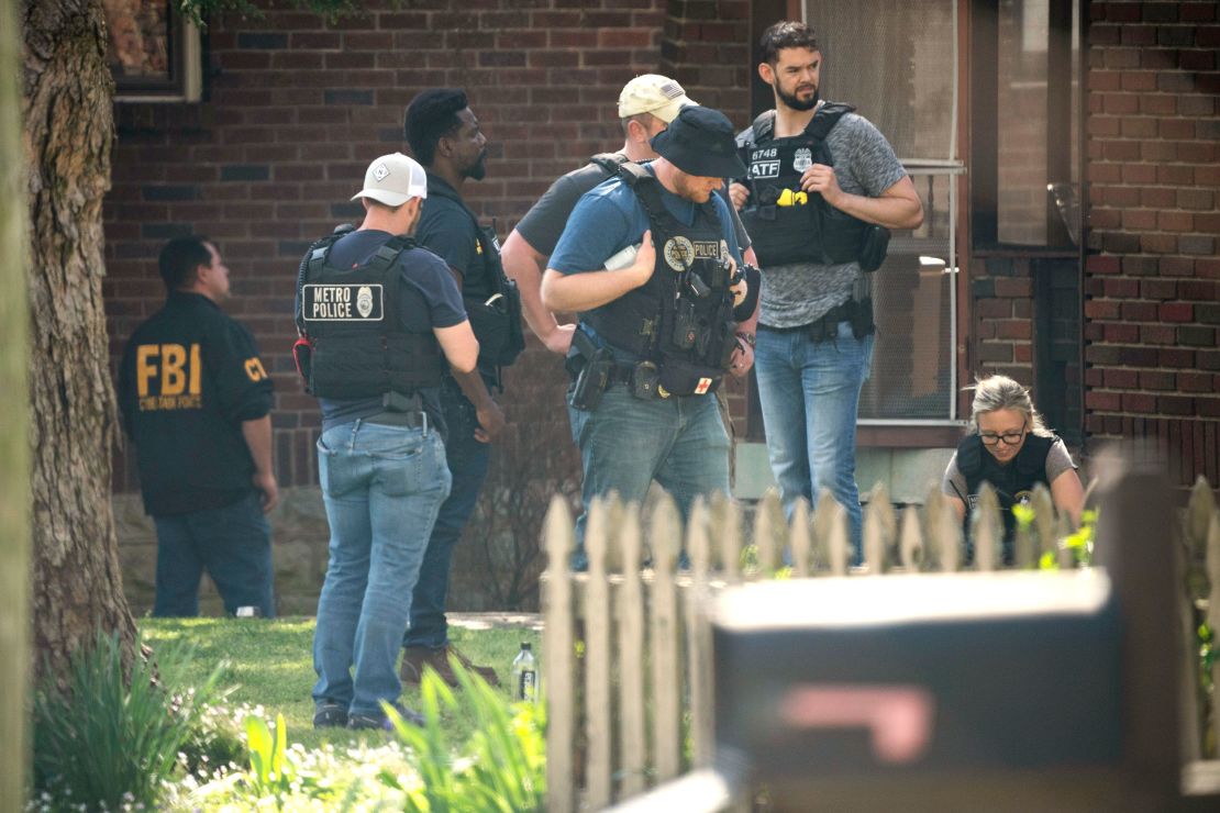Metro Nashville Police and FBI agents search a home following a mass shooting at The Covenant School, on March 27 in Nashville, Tennessee. 
