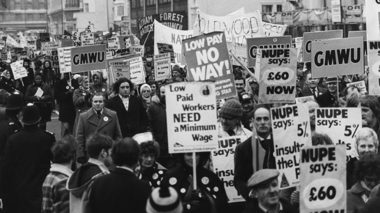 Striking ambulance workers march to London's House of Commons to protest against the government's 5% limit for pay rises, January 1979. Over 100,000 ambulance workers took part in the nationwide strike. 