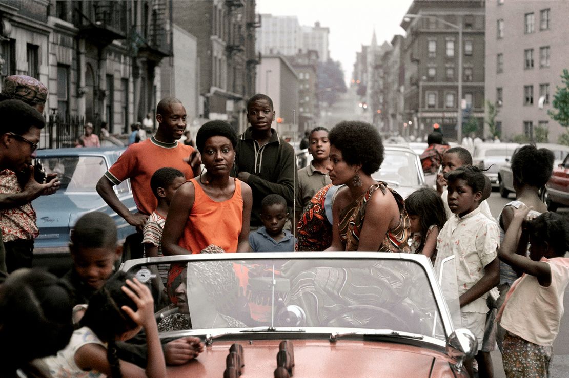 Women in cars gathered for Garvey Day, an annual event commemorating black activist Marcus Garvey.