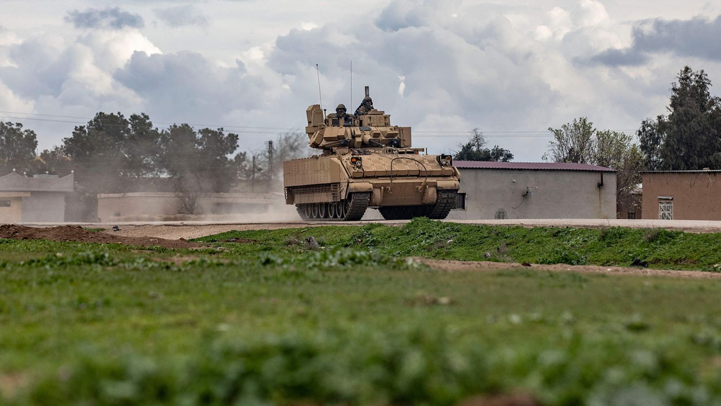 A US armored military vehicle drives on the outskirts of Rumaylan in Syria's northeastern Hasakeh province, bordering Turkey, on March 27.