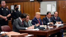 Former U.S. President Donald Trump appears in court with members of his legal team for an arraignment on charges stemming from his indictment by a Manhattan grand jury following a probe into hush money paid to porn star Stormy Daniels, in New York City, U.S., April 4, 2023. REUTERS/Steven Hirsch/Pool