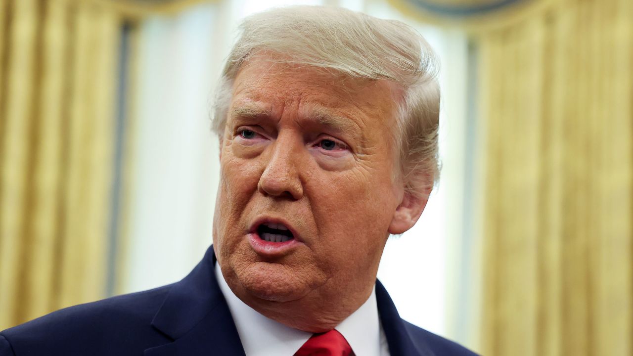 U.S. President Donald Trump speaks during a ceremony to award the Presidential Medal of Freedom to retired football coach Lou Holtz in the Oval Office at the White House in Washington, U.S., December 3, 2020.