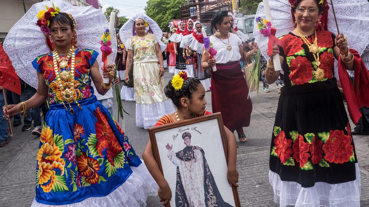 Dressed in traditional Zapotec attire, muxes in Juchitán, Mexico, partake in a parade for the annual 