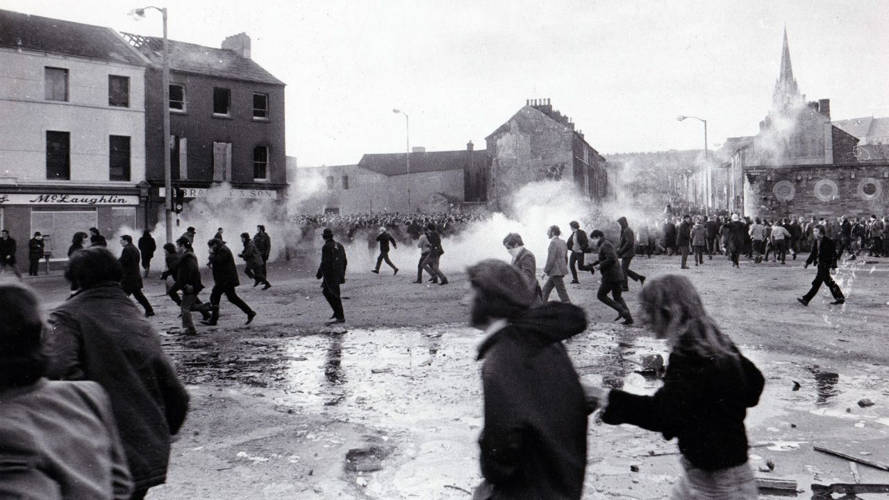 Demonstrators run from tear gas during the "Bloody Sunday" riots, which broke out after British troops shot dead civilians during a civil rights march in Derry/Londonderry on January 30, 1972. 