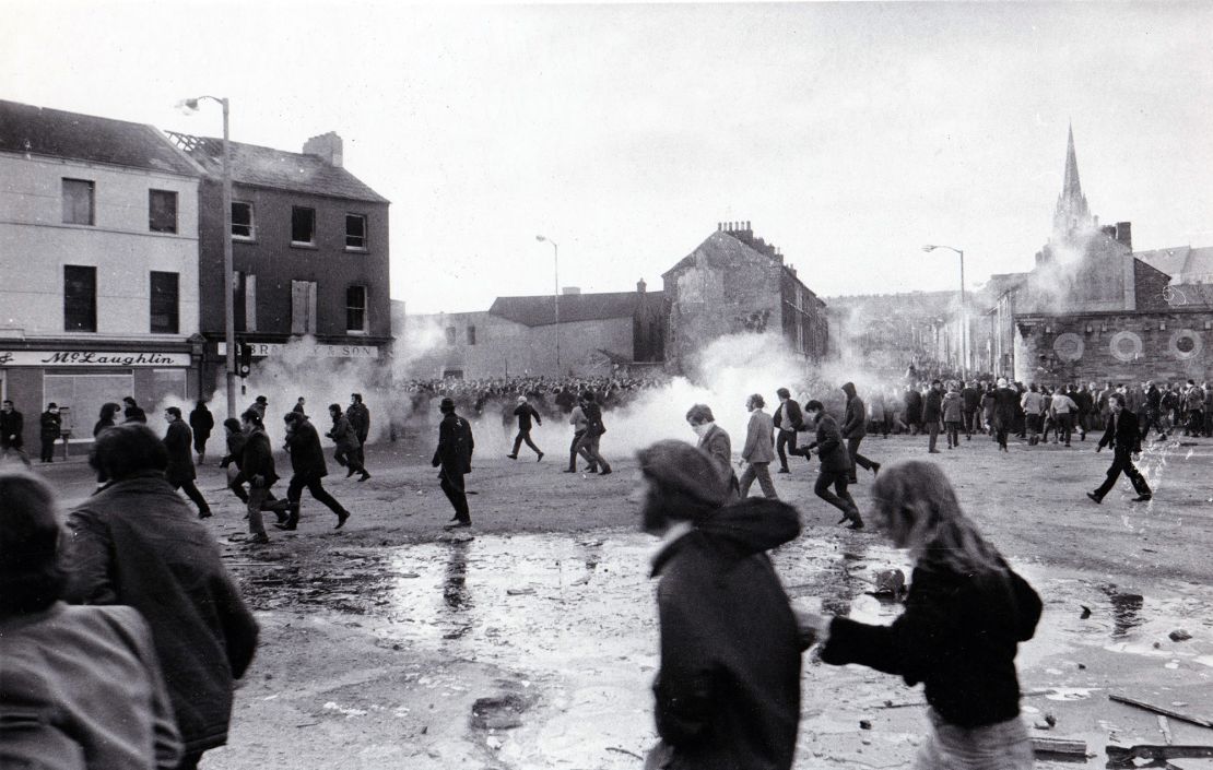 Demonstrators run from tear gas during the "Bloody Sunday" riots, which broke out after British troops shot dead civilians during a civil rights march in Derry/Londonderry on January 30, 1972. 