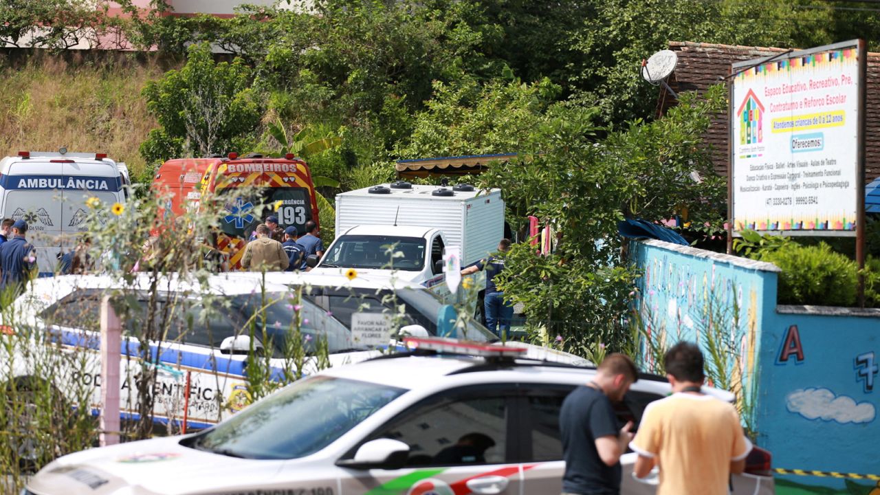 Forensic technicians, ambulances and policemen outside a pre-school after a 25-year-old man attacked children, killing several and injuring others, in Blumenau on April 5, 2023. 