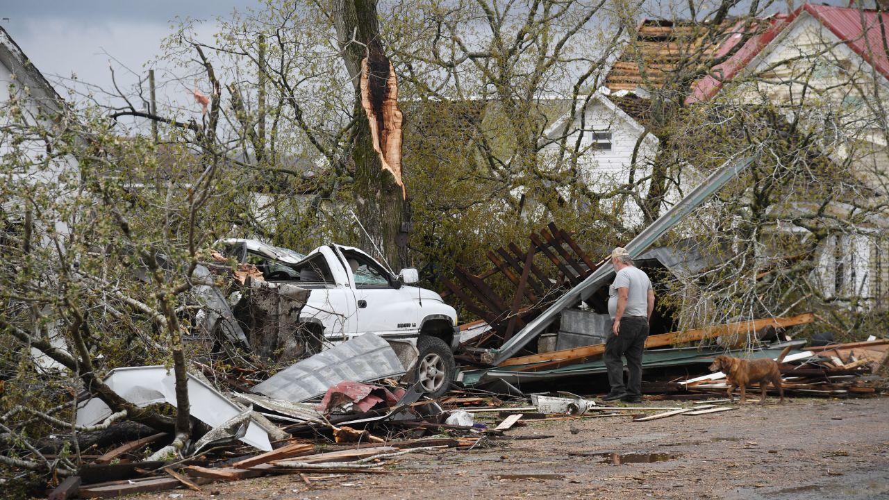 A man surveys the wreckage and debris outside his destroyed home on April 5, 2023 in Glenallen, Missouri. 