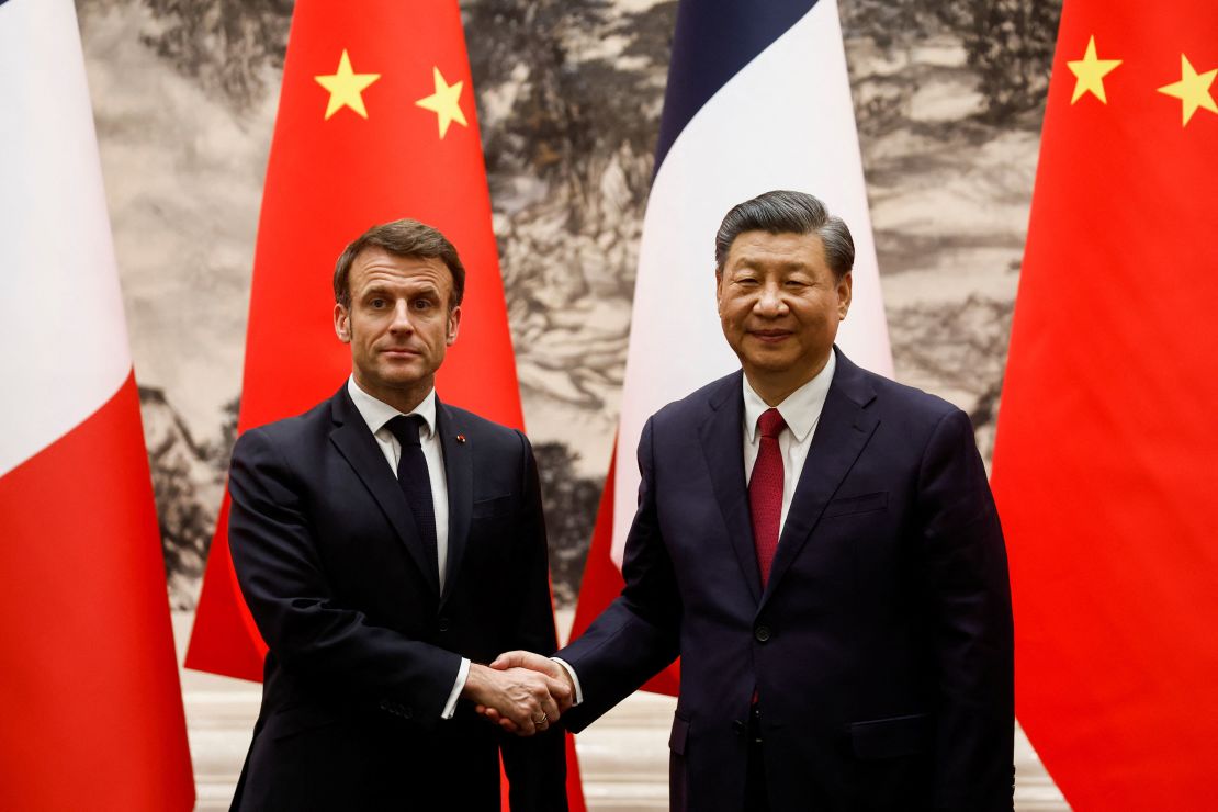 Xi and Macron shake hands at a signing ceremony at the Great Hall of the People.