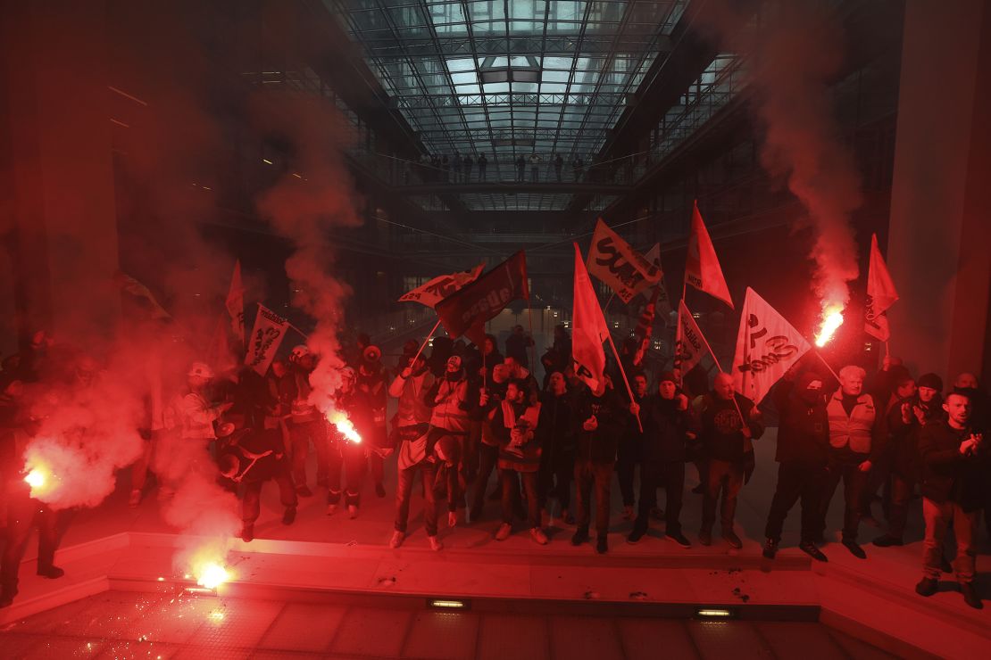 Workers invade the Centorial building that houses BlackRock's office in Paris on April 6, 2023.