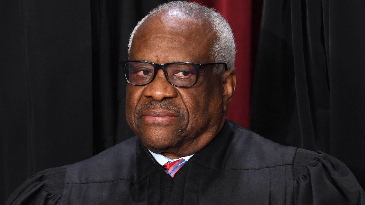 Associate US Supreme Court Justice Clarence Thomas poses for the official photo at the Supreme Court in Washington, DC on October 7, 2022.