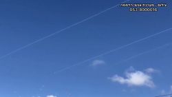 Trails from rockets can be seen over the skies of northern Israel in this screengrab taken from video.