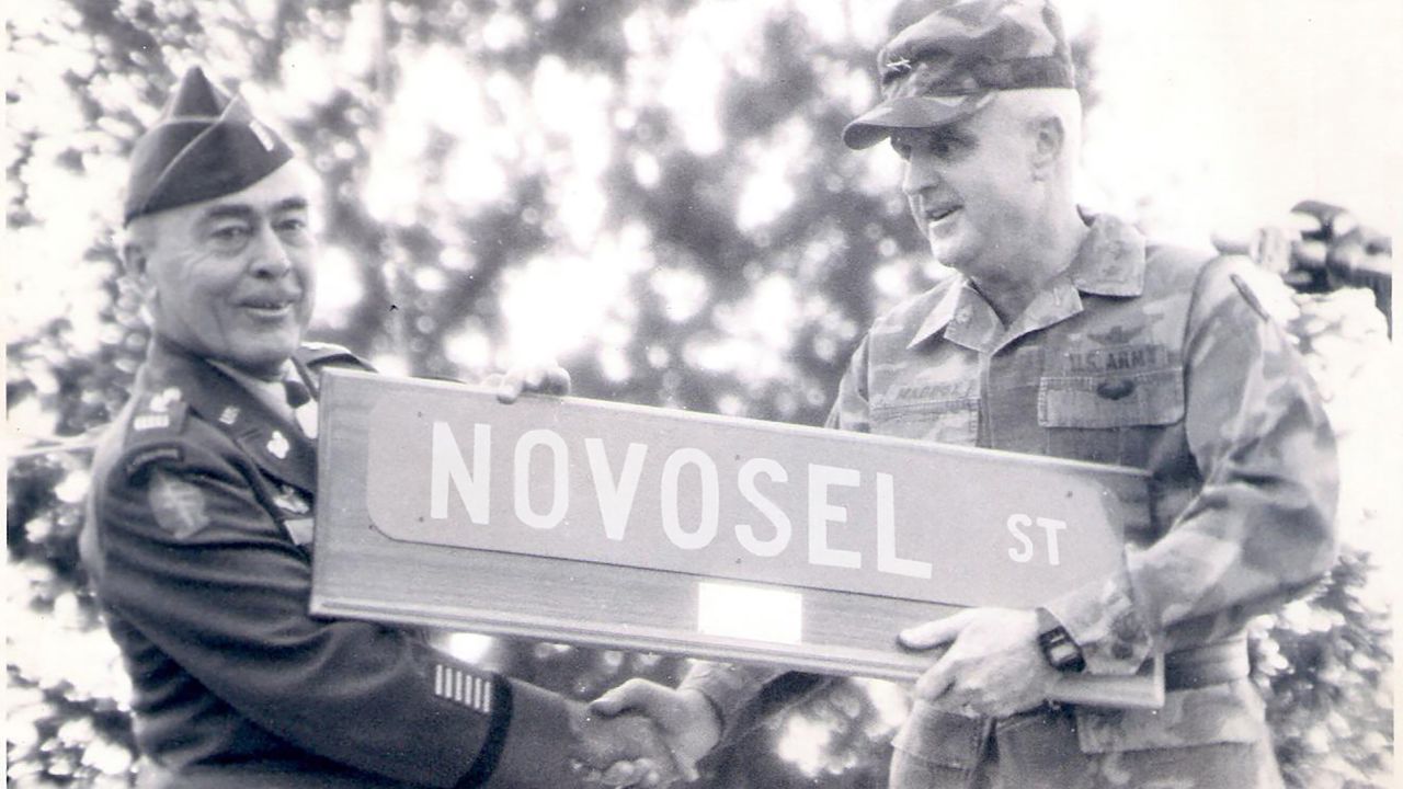 CW4 Mike Novosel receives the first street sign named after him from Maj. Gen. Bobby Maddox, then-Fort Rucker commander.