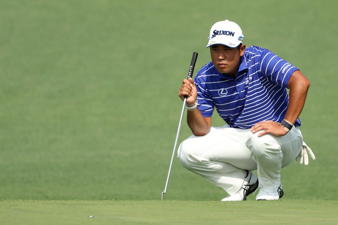 Hideki Matsuyama, who won the tournament two years ago, looks over a putt on the second hole.