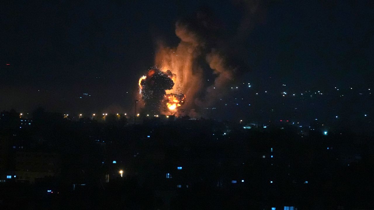 Smoke and fire rises from an explosion caused by an Israeli airstrike on Gaza City early Friday.