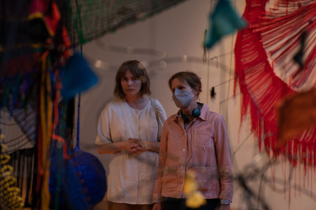 Michelle Williams and Kelly Reichardt on the set of "Showing Up," framed by an artwork by Michelle Segre.