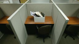 Cubicle with Box of Personal Belongings - stock photo