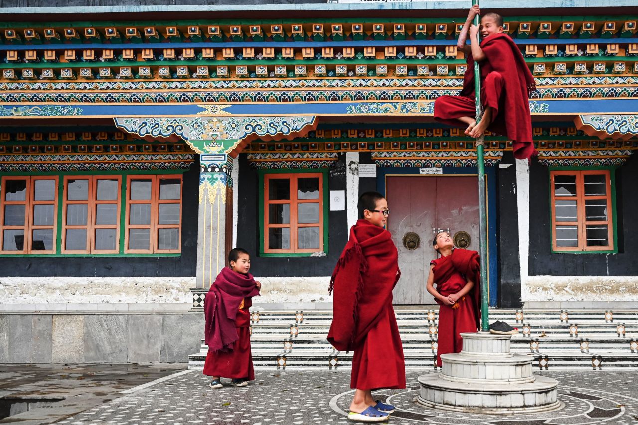 Young Buddhist monks play between prayers at a monastery in Tawang, India, on Wednesday, April 5.