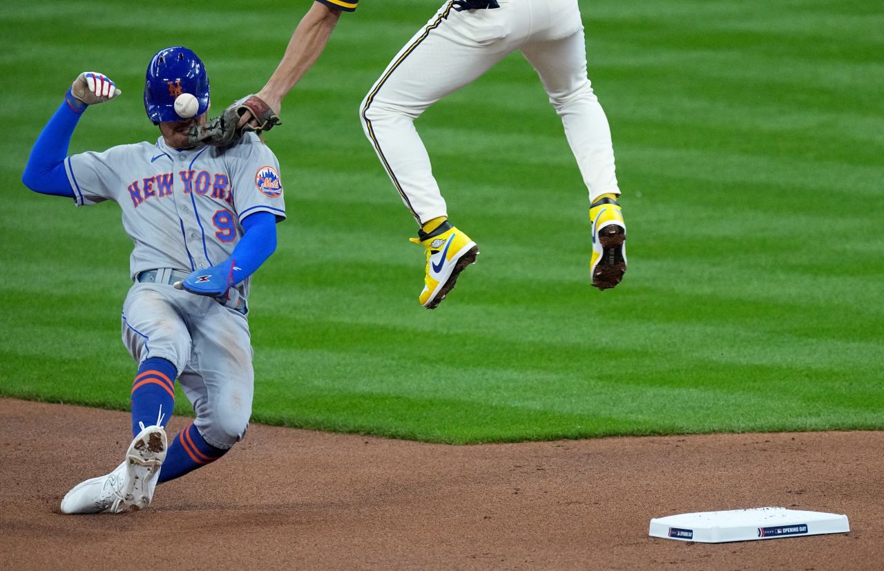 New York Mets center fielder Brandon Nimmo slides into second base as Milwaukee shortstop Willy Adames tries to make a tag during a Major League Baseball game on Monday, April 3.